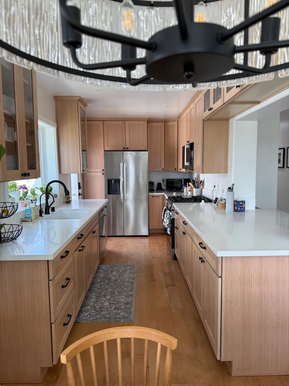 Rift oak shaker galley kitchen with white quartz countertops and stainless appliances
